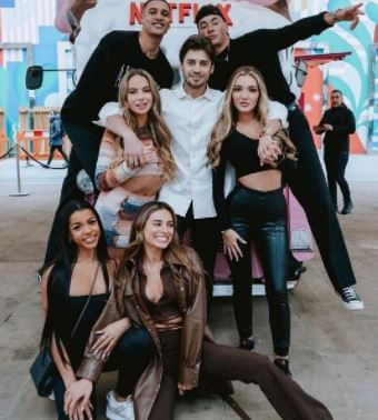 Izzy Fairthorne with contestants of Too Hot to Handle.